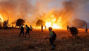France firefighters hopeful, as Spain ends national emergency