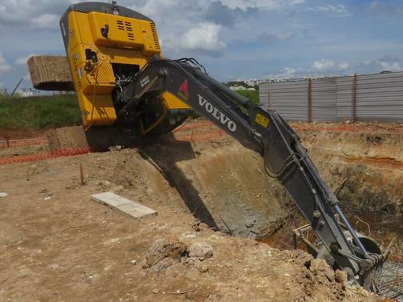 The work site accident at Tampines resulted in the death of one worker who was hit by a concrete bucket when the excavator started to topple.