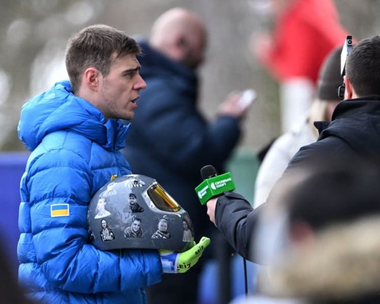 IOC 'begs' defiant Ukrainian to race without war dead helmet