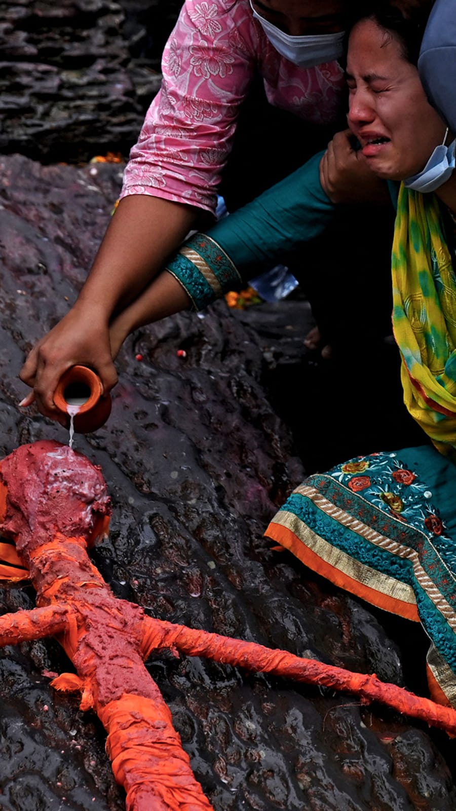 Nepali families hold symbolic funerals for missing after floods