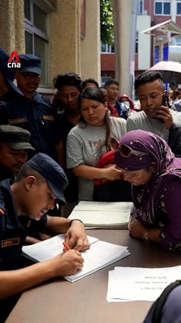 Families wait in anguish for news as Nepal flood toll climbs