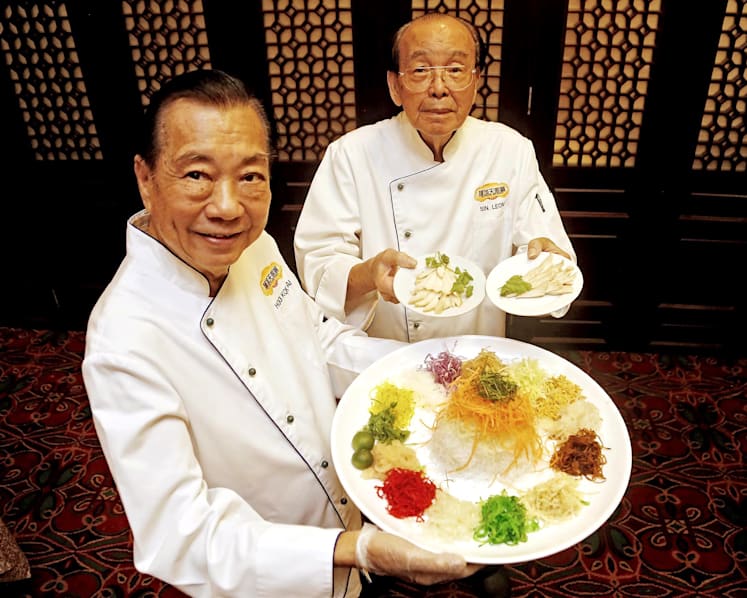 Toss the raw fish — heart of yusheng lies in the sauce