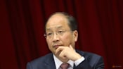 Former head of China securities watchdog Yi Huiman under corruption probe