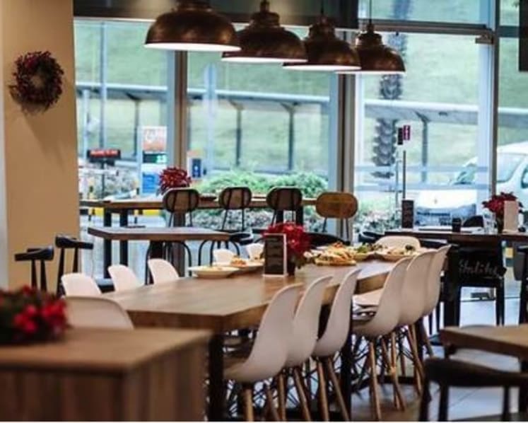 Woman who pocketed S$30,000 from restaurant at NUS Business School gets fine