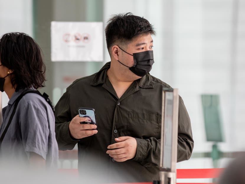 Lau Zhi Zhang arriving at the State Courts on Feb 21, 2022.