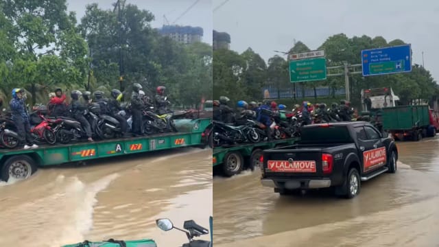 柔佛水灾摩托寸步难行  拖格罗厘运渡过积水区