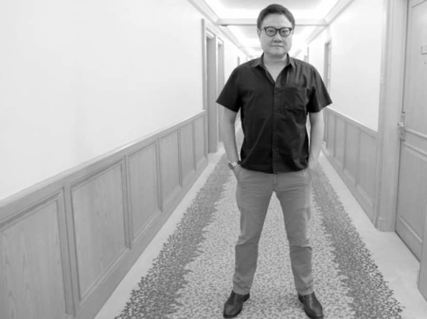 Director Eric Khoo outside his office in Goodwood Park Hotel. Photo: Lam Shushan/Channel NewsAsia