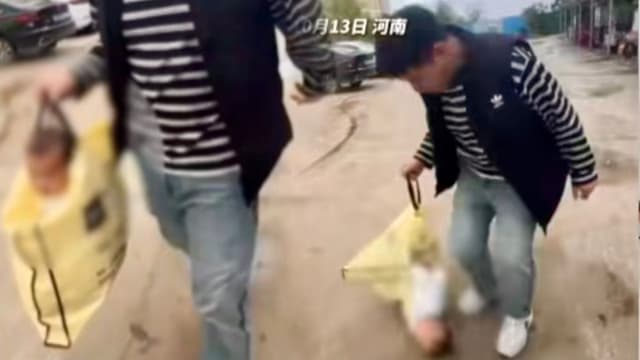 河南父亲用购物袋提着玩 宝宝头朝下重摔水泥地