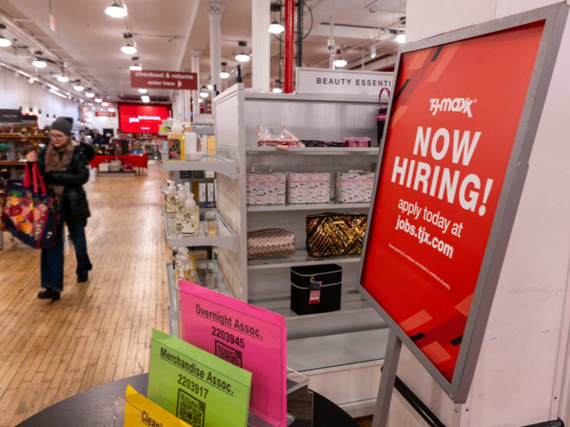 A 'now hiring' sign is displayed in a retail store in Manhattan on Jan 5, 2024 in New York City. 