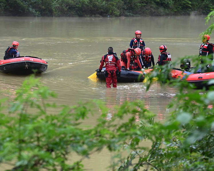 At least nine killed in southwest China after truck falls into river in heavy rain