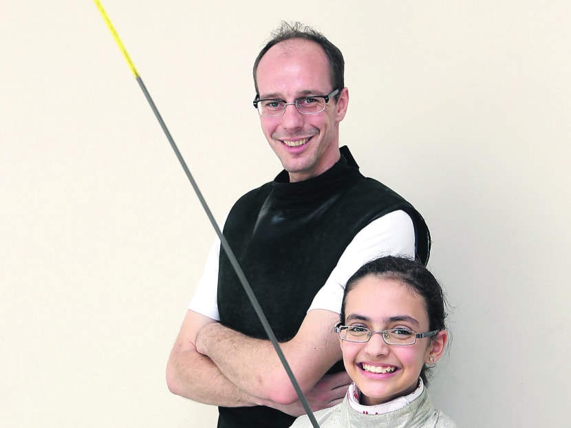 Amita (seen here with her coach Ralf Bissdorf) is aiming to win Singapore’s first Olympic medal in fencing. Photo: Wee Teck Hian