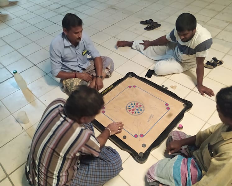 Isolated in dorms, migrant workers seek to keep themselves occupied as they ponder their future