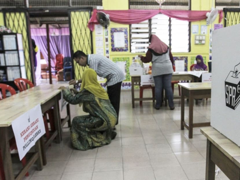 Election officers making final preparations yesterday on the eve of the Sungai Besar by-elections at Haji Dorani school in Sabak Bernam district. Photo: Malay Mail Online