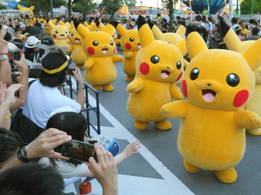 In this file photo taken on August 7, 2016 performers dressed as Pikachu, the popular animation Pokemon series character, perform in the Pikachu parade in Yokohama. In this file photo taken on August 7, 2016 performers dressed as Pikachu, the popular animation Pokemon series character, perform in the Pikachu parade in Yokohama.