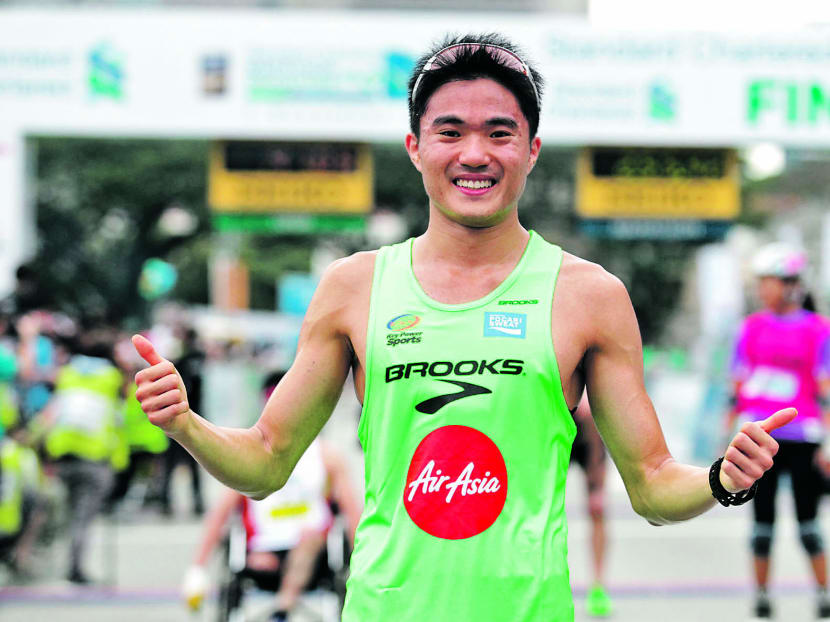 After an approximate two-hour wait, three-time Singapore marathon winner (local) Mok Ying Ren was reinstated as the race winner with his time of 2hr 54min 17.90sec. Photo: Wee Teck Hian