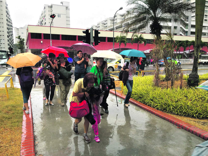 Rain brings relief to sweltering S’pore