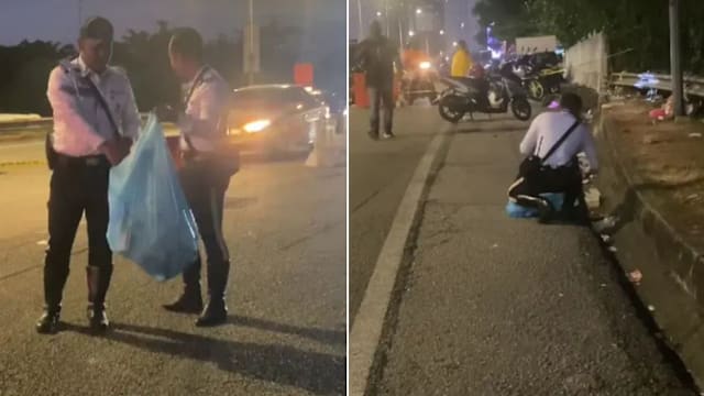 庆典期间默默拾路边垃圾 马国两警员暖举感动网民