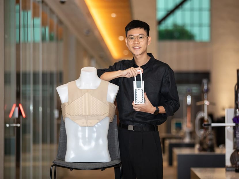 Mr Siew E Ian, 24, with his Auxobrace that won him the James Dyson Award.