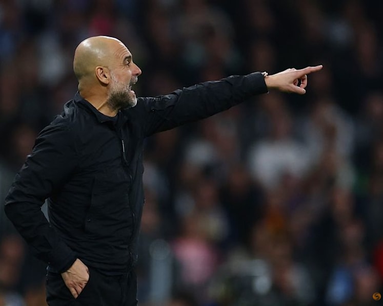 Guardiola defiant despite City's Champions League mauling