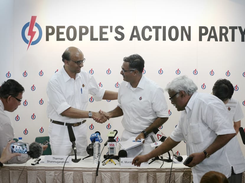 Deputy Prime Minister Tharman Shanmugaratnam shakes the hand of Murali Pillai, 47, a long-time People's Action Party activist who will be the party's candidate in the Bukit Batok by-election. Photo: Jason Quah