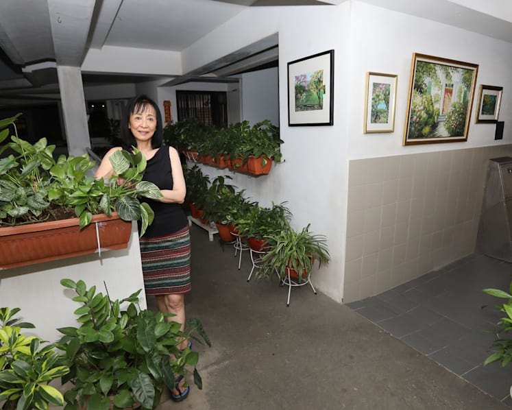 Self-taught artist transforms HDB common corridor into mini art gallery surrounded by greenery