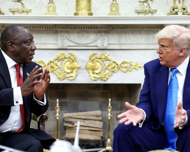 Trump challenges South Africa's president on White House trip, with white farmer murder claims