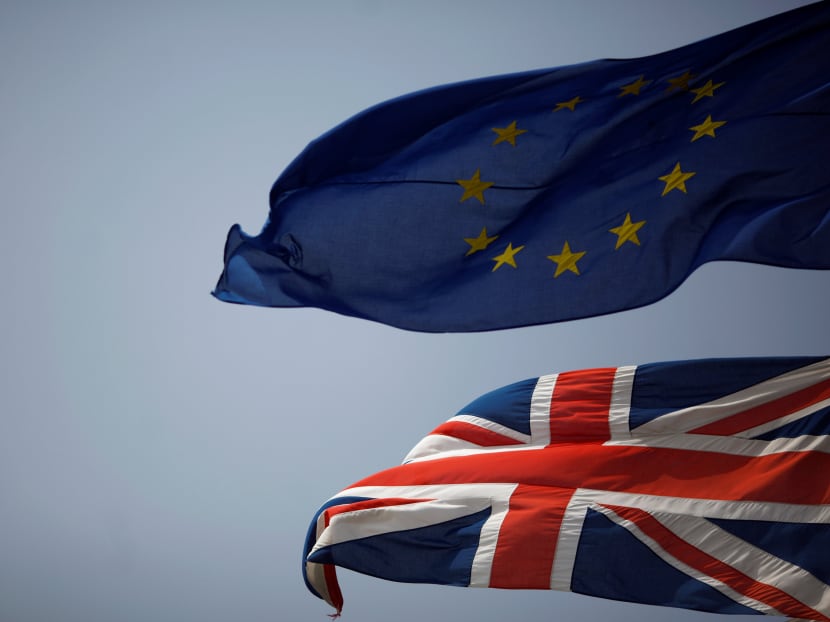 The Union Jack (bottom) and the European Union flag are seen flying, at the border of Gibraltar with Spain, in the British overseas territory of Gibraltar, historically claimed by Spain, June 27, 2016, after Britain voted to leave the European Union in the EU Brexit referendum. Photo: Reuters