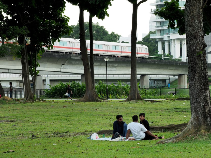 Foreign workers hanging out at the open area near Kallang MRT station in December, 2017.