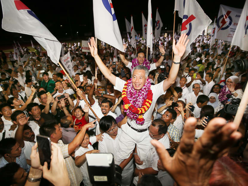 PM Lee Hsien Loong celebrates with supporters after the announcement of GE2015 results. Photo: Ray Chua/TODAY PM Lee Hsien Loong celebrates with supporters after the announcement of GE2015 results. Photo: Ray Chua/TODAY