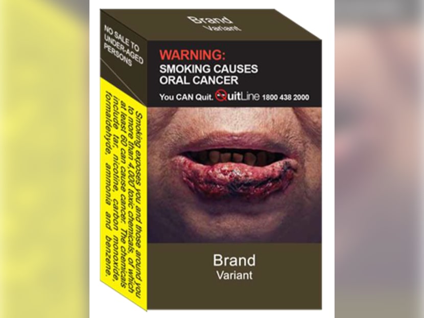A sample of standardised packaging with enlarged graphic health warnings on a cigarette pack.