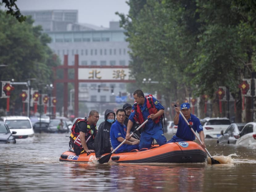 Rescue workers in a boat go through a flooded street in a neighbourhood where days of heavy rain from remnants of Typhoon Doksuri have caused heavy damage in Beijing, China, on Aug 1, 2023. Rescue workers in a boat go through a flooded street in a neighbourhood where days of heavy rain from remnants of Typhoon Doksuri have caused heavy damage in Beijing, China, on Aug 1, 2023.