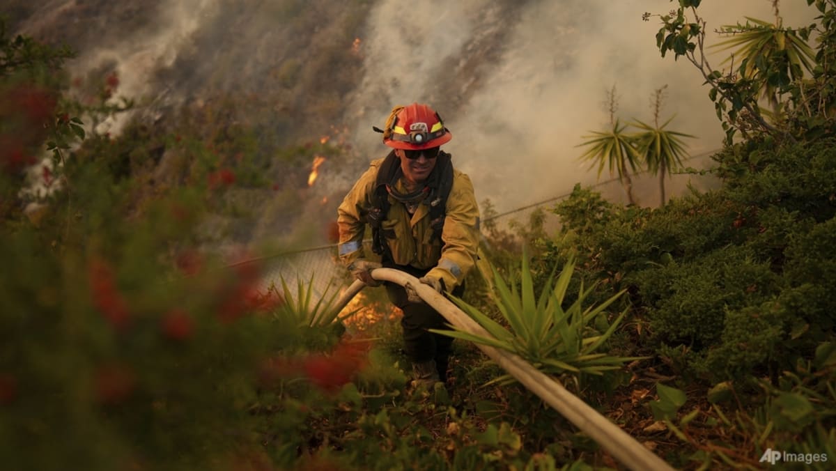 Firefighters race to beat LA blazes as winds grow and death toll hits 16 Firefighters race to beat LA blazes as winds grow and death toll hits 16