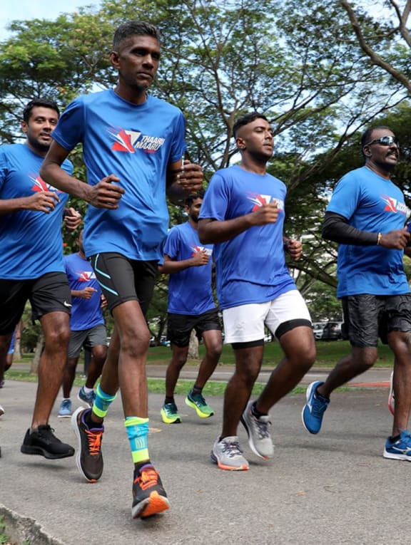 The Thaarumaaru Runners — a running group for the Indian community — on a long morning run at East Coast Park on July 31, 2022.