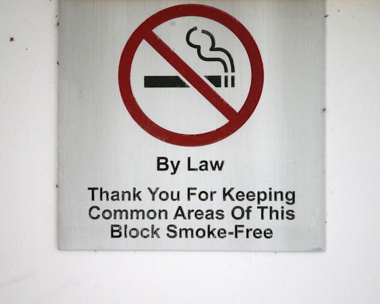 Jail for man who offered officers S$12 bribe after being caught smoking at void deck