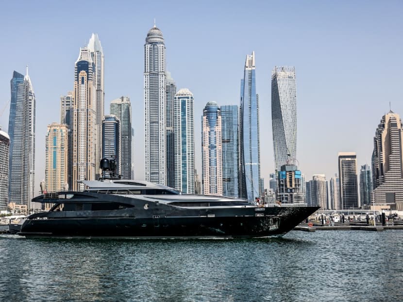 A luxury yacht is pictured off the Dubai Marina Beach in the Gulf emirate, on June 10, 2021.