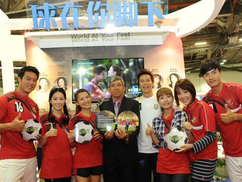 Minister for Communications and Information Yaacob Ibrahim joins MediaCorp artistes, who will be starring in the serial World At Your Feet, at the Asia TV Forum and Market and ScreenSingapore Opening Ceremony. Photo: Ministry of Communications and Information