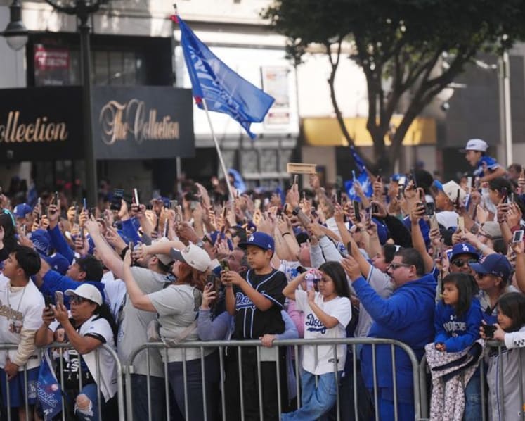 Baseball-Ohtani teases 'three-peat' as Dodgers parade draws Los Angeles crowds