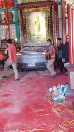 Car crashes into Bangkok shrine after driver loses consciousness