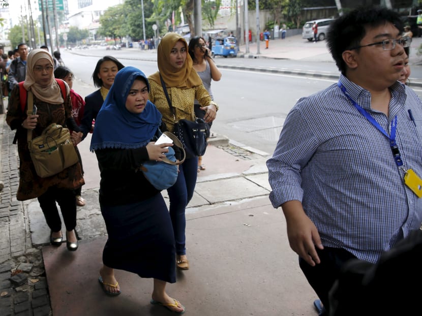 Seven dead in Jakarta blasts, gunfight