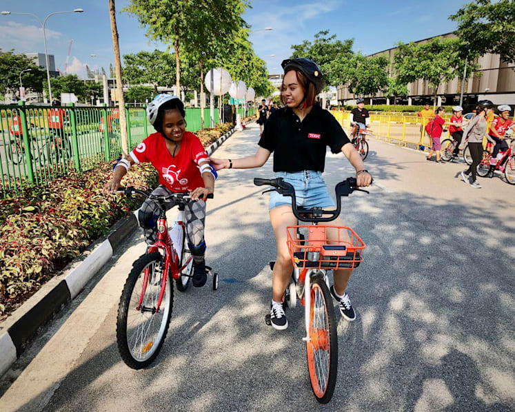 Cheered on by family, special-needs youths take part in mass cycling event