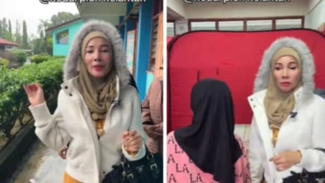 穿羽绒外套化浓妆访灾区 马国女商人穿着打扮惹议