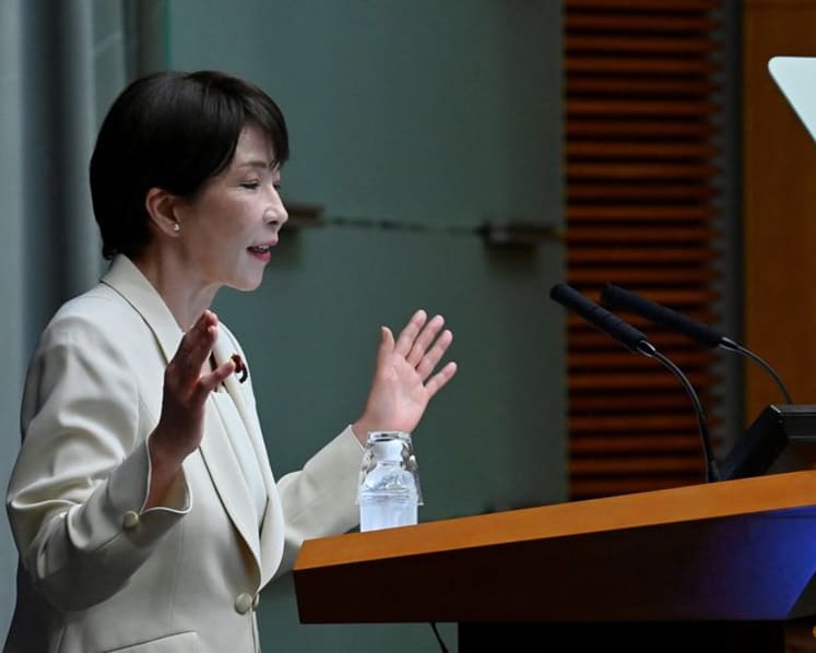 Japan PM vows to proceed with temporary cut in sales tax