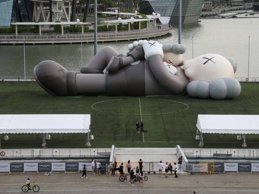 A 42m-long inflatable sculpture by American artist Kaws lies on The Float@Marina Bay.