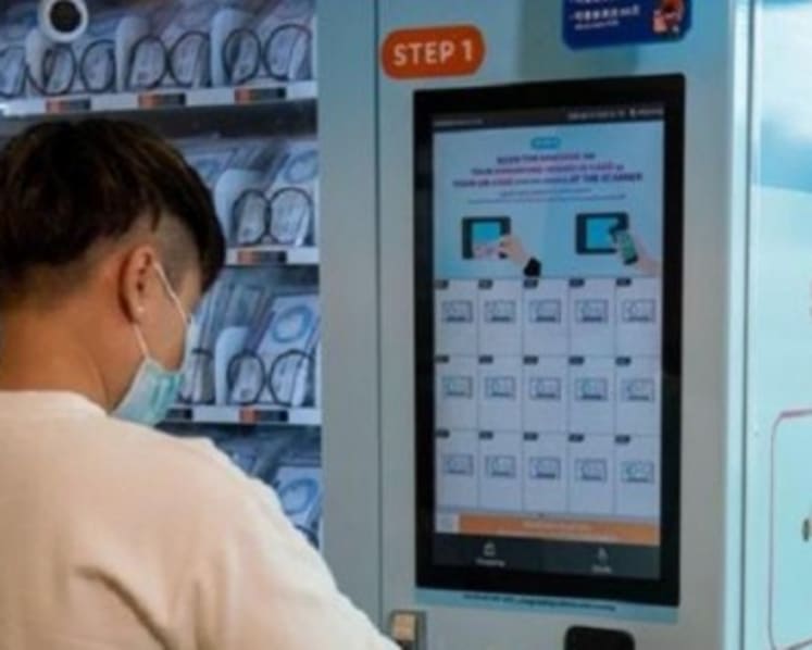 Police probe 10 people for allegedly using illegally obtained personal data to redeem face masks from vending machines