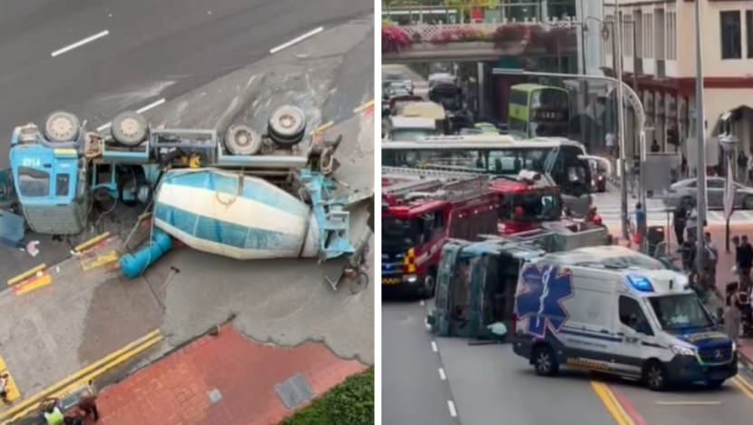 Cement truck overturns in Chinatown; driver taken to hospital Cement truck overturns in Chinatown; driver taken to hospital
