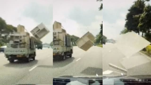惊险一幕！天降“家具”差点砸中行驶轿车 