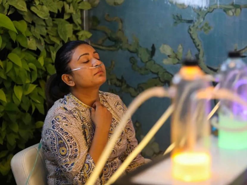 Ms Nishika Waghela, 33, breathes in oxygen mixed with different scents at Oxy Pure.