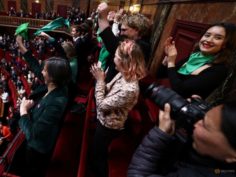 MPs and senators react after President of the National Assembly Yael Braun-Pivet announced the result of the vote during the convocation of a congress of both houses of parliament in Versailles, southwestern of Paris, France on March 4, 2024, to anchor the right to abortion in the country's constitution.