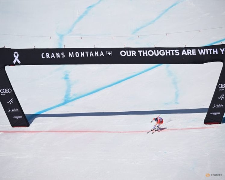 Alpine skiing-Von Allmen heads to Olympics with a win, Odermatt fourth