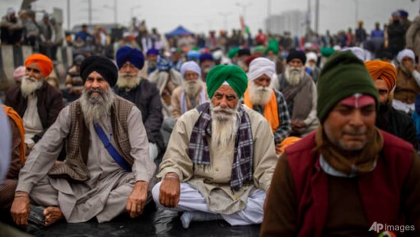 India's top court suspends implementation of new farm laws